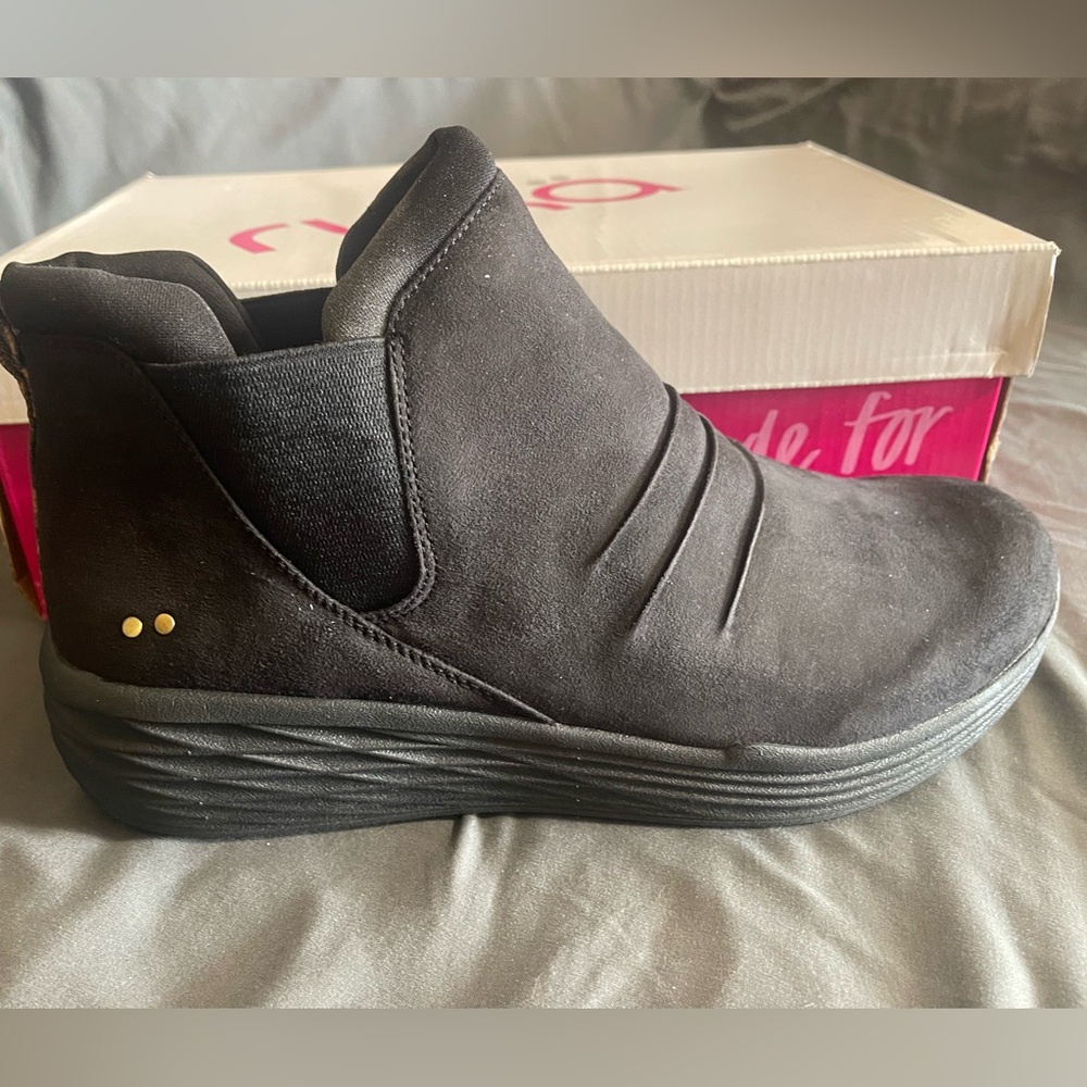 Brand new. Never worn Ryka water resistant rain booties. Cheetah accent.